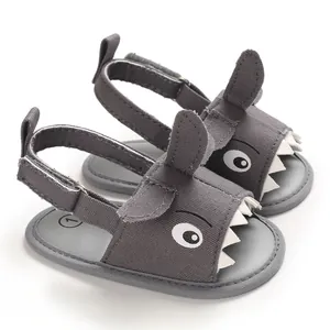 Detailed view of grey shark-themed baby sandals featuring soft soles and velcro straps