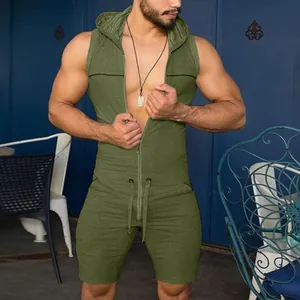 Green men's hooded sleeveless romper jumpsuit in athletic style shown on model outdoors