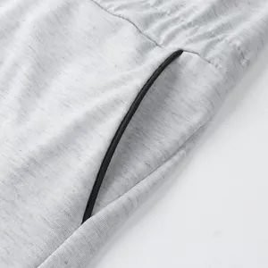 Close-up macro detail of side pocket on grey marl jersey men's athletic jumpsuit