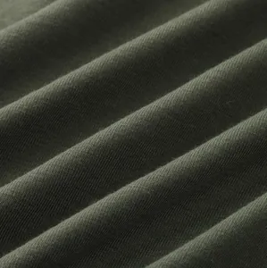 Macro detail of breathable dark olive green knitted fabric for men's jumpsuits
