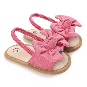 Sandalias rosas de aprendizaje para bebé con lazo grande y correa elástica de 0 a 1 año