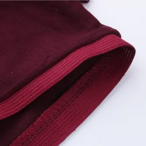 Close-up of burgundy men's casual jumpsuit showing high-quality stitching and rib cuff