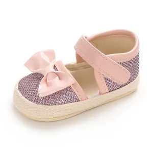 Pink glitter baby princess walking shoe with soft sole and a stylish bow detail