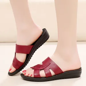 Comfortable maroon leather wedge sandals for middle-aged women with floral cutouts