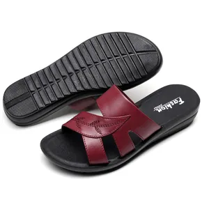 Elegant wine red leather slide sandals for women with comfortable flat anti-slip soles.