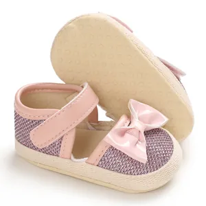 Detail view of pink glitter baby walking shoes with soft dot-patterned anti-slip sole
