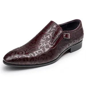 Detailed macro view of the embossed pattern on a burgundy men's monk strap dress shoe
