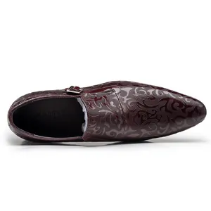 Top-down view showing intricate embossed pattern of men's leather monk strap shoe