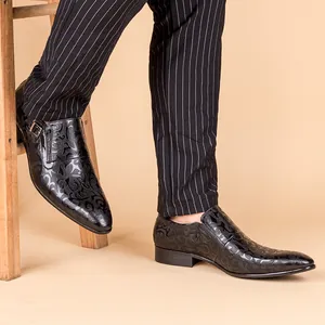 Detailed view of men's black embossed leather dress shoes in a classic British style.