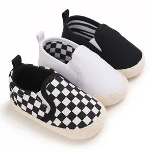 Soft sole baby walking shoes in checkered, white and black styles for infants 0-1 year