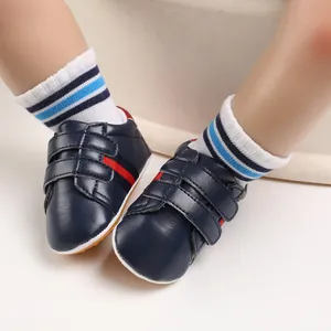 Close-up of navy blue baby pre-walker shoes with anti-slip soft soles for infants 0-1 year old.