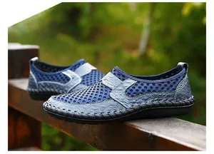 Side view of men's breathable mesh slip-on shoes with crocodile texture accents