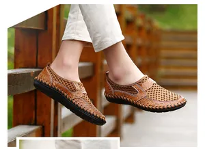 Detail of men's breathable brown mesh loafers with slip-on design for summer.