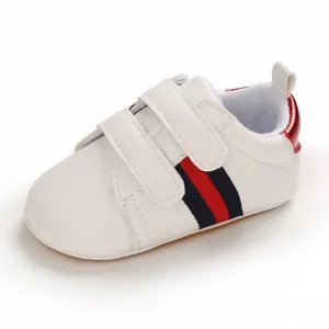 Stylish white infant boys leather walking shoes featuring soft anti-slip rubber soles