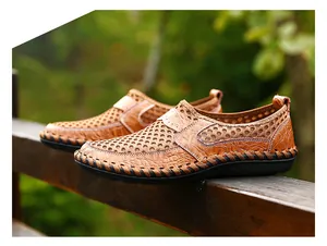 Detail view of brown men's breathable mesh loafers with hand-stitched sole edges.
