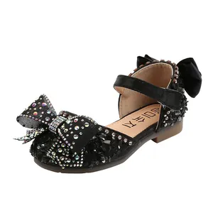 Elegant black girls princess shoes with sparkling bows and rhinestones for dancing.