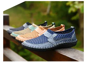 Breathable men's summer mesh slip-on loafers displayed in multiple colors on a wooden railing.