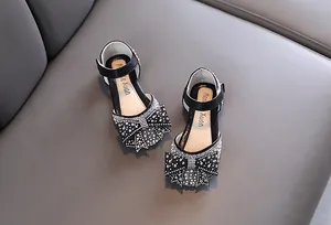 Elegant black girls princess shoes with sparkling rhinestone bow details for stage performance