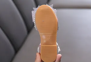 Detailed macro view showing the non-slip rubber sole and size 26 of girls' princess shoes