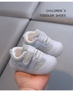 Close-up detail showing soft blue mesh baby toddler shoes with secure velcro strap closure.