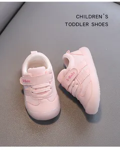 Detailed macro view of pink toddler walking shoes with soft sole and Velcro strap