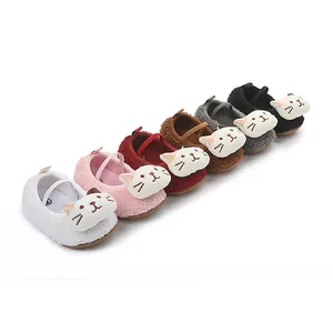 Detail view of colorful cartoon cat baby shoes with soft plush lining and elastic strap.