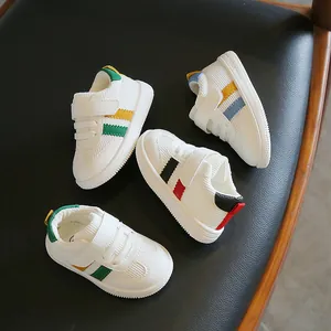 Toddler white faux leather walking shoes with soft soles and hook-and-loop straps