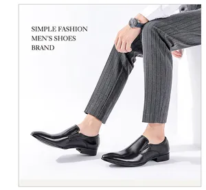 A side profile detail of black leather pointed-toe loafers for formal business men