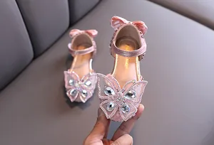 Elegant girls pink princess sandals with sparkling rhinestone butterfly and heel bow detail