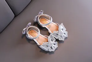 Detailed top view of silver girls princess sandals with sparkling rhinestone butterfly