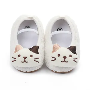 Soft white plush baby walking shoes with cute cat face embroidery for winter season