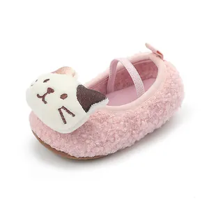 Close-up of a pink plush baby walking shoe featuring a cute cartoon cat decoration