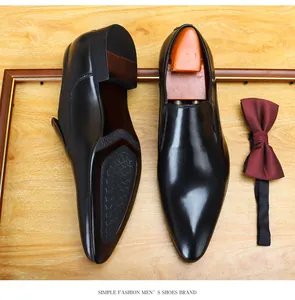 Close-up of men's pointed-toe formal leather shoes showing top view and non-slip sole
