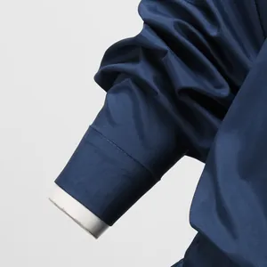 High-detail shot of navy blue sleeve cuff on a professional men's jumpsuit suit