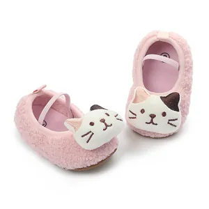 Detailed view of pink fleece baby shoes featuring a cute cartoon cat face design.