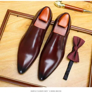 Close-up of elegant burgundy men's pointed-toe leather dress shoes for formal events