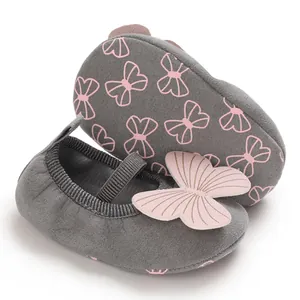 Close-up of baby girl walking shoes with 3D pink butterfly and non-slip soft sole