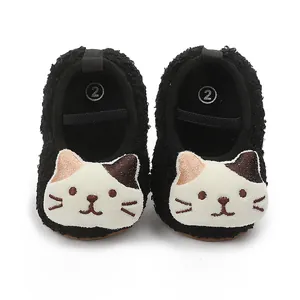 Soft fuzzy black baby walking shoes with cute white cat face embroidery
