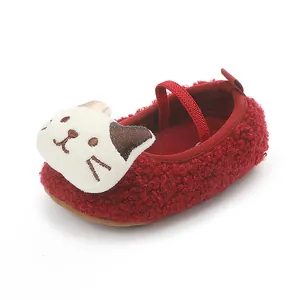 Soft red plush baby slippers with cute cartoon cat face detail for infant boys and girls