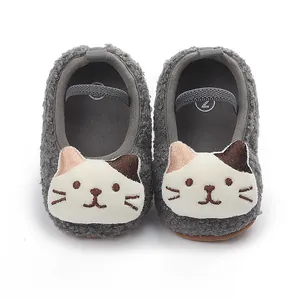 Grey plush baby walker shoes with cute embroidered cat face and elastic strap design