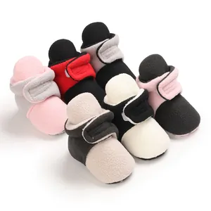 Multi-color collection of warm soft-sole fleece cotton shoes for infant boys and girls.