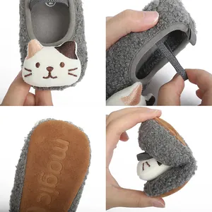 Detailed view of baby cat slippers showing fuzzy texture and flexible non-slip sole.