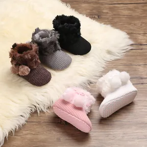 Adorable baby knit boots with faux fur trim and cute pom-poms, non-slip soft sole shoes