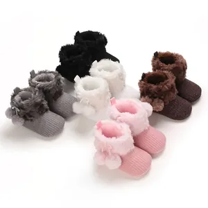 Cute baby girl knitted boots with faux fur and pom-poms in various colors for 0-1 year olds
