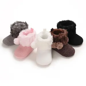 Soft knit baby boots with plush fur collar and cute pom-poms in various colors