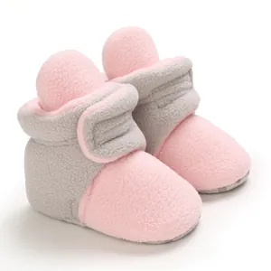Soft fleece baby winter booties in pink and grey color-block design
