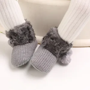 Cute princess baby knit booties with gray plush trim and pompom details for 0-1 years.