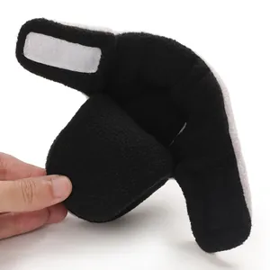 Detailed view of the soft fleece lining and velcro strap of baby winter cotton shoes