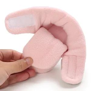 Detail of soft pink plush baby shoe with adjustable velcro closure for infants
