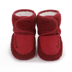 Red infant winter fleece booties with warm sherpa lining and hook-and-loop closure